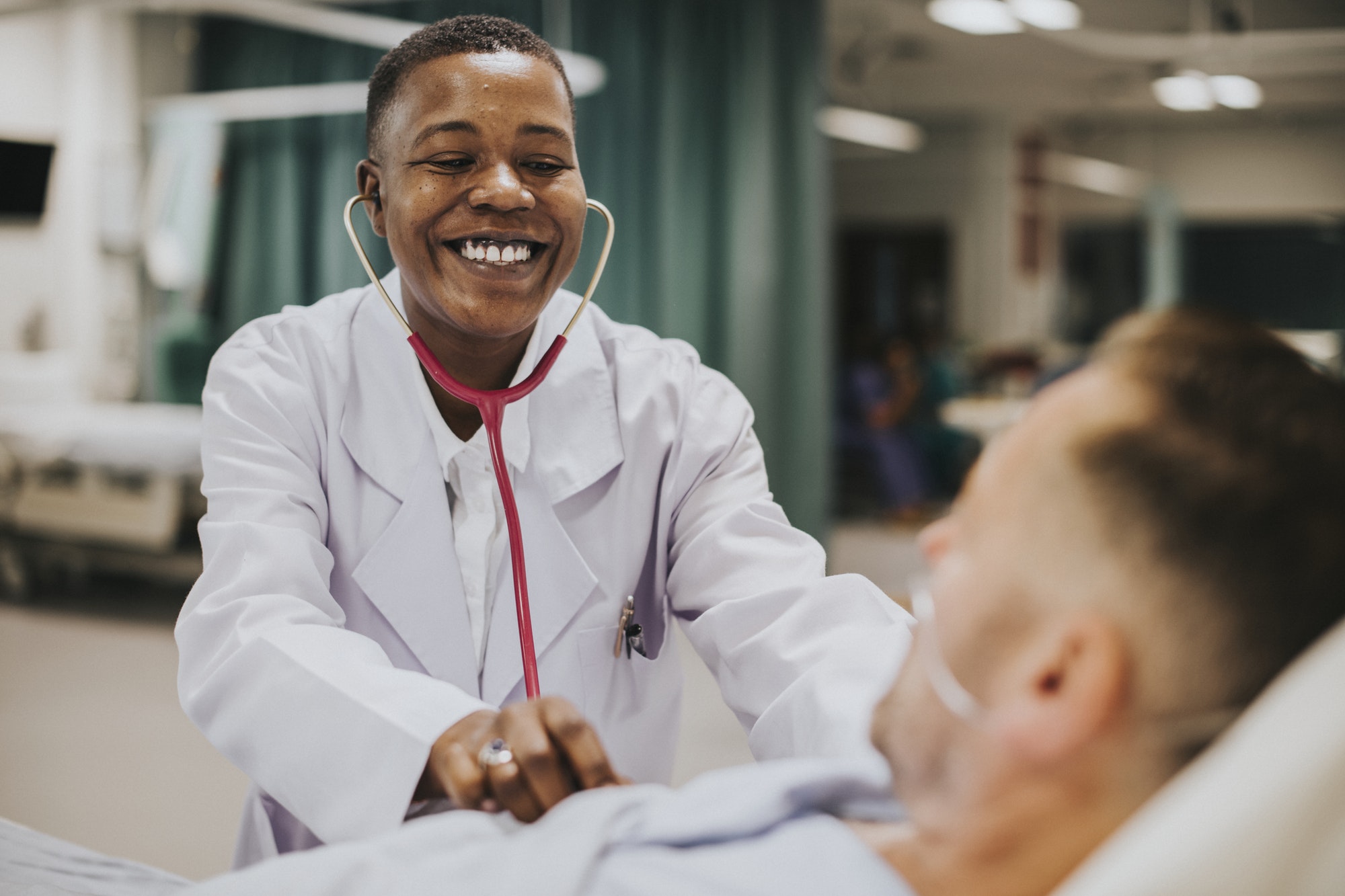 Doctor doing a checkup on a hospitalized patient